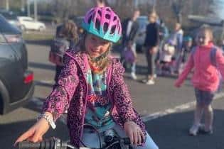 A Gaelscoil na Daróige pupil setting a positive example and helping the school achieve a prestigious Sustrans School Mark Gold Award.