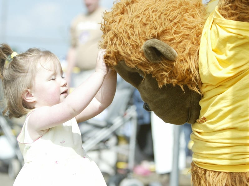 Sarah Bonner playing with one of the large gorillas at Termonbacca Fun Day.  (1007JB133)