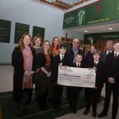 CHILDREN IN CROSSFIRE CHEQUE. . . . .Pupils and staff from St. Joseph’s Boys School pictured handing over a cheque for £857.14 to Children in Crossfire, monies raised through a recent Pier Jump at the local Creggan Reservoir. Accepting the cheque was Richard Moore and Shauna O’Neill from Children in Crossfire and school staff include Mr. Paul Kealey, Vice Principal, Fiona Page, Anne-Marie Faulkner and Catherine Logan. (Photo: Jim McCafferty Photography)