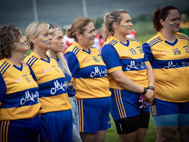 Wolfhounds (Limavady) standing for the National Anthem on Saturday.