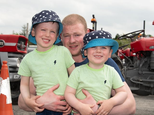 Stanley, Jamie and Adam Eaton at the Allen Wylie Memorial Tractor Run from Letterkenny to Newtoncunningham on Saturday last held to raise funds for the Good & New Cancer Bus. Photo Clive Wasson
