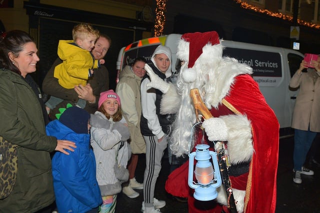 Santa greeting children at the Derry Christmas procession on Sunday evening last. Photo: George Sweeney. DER2248GS - 26 