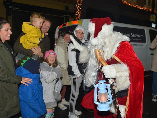 Santa greeting children at the Derry Christmas procession on Sunday evening last. Photo: George Sweeney. DER2248GS - 26