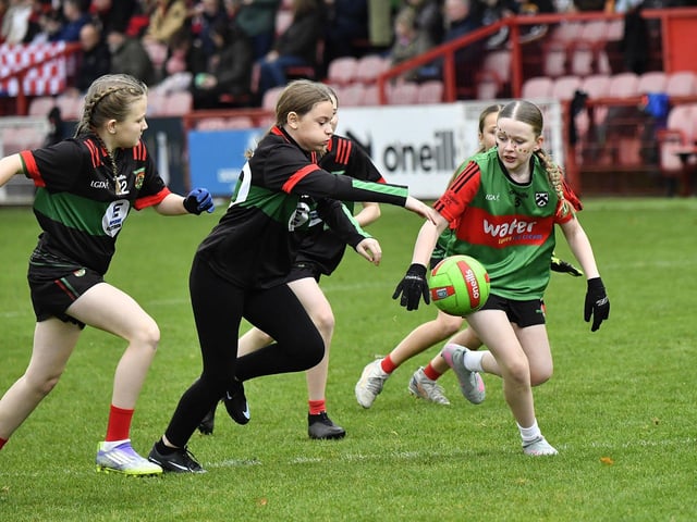 Young footballers from Doire Trasna and Slaughtmanus Under 12 teams play at half-time at the Derry Junior Football Championship Final held in Celtic Park on Sunday afternoon. Photo: George Sweeney