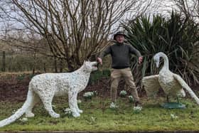 Artist Kevin Harkin with snow leopard and swan