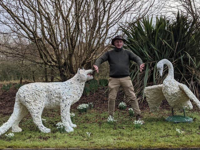 Artist Kevin Harkin with snow leopard and swan