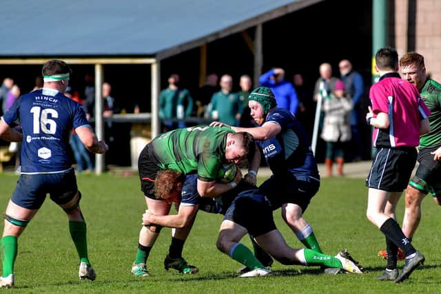 City of Derry prop Adam Marley battles to keep possession against Ballynahinch Photo: George Sweeney. DER2312GS – 56 