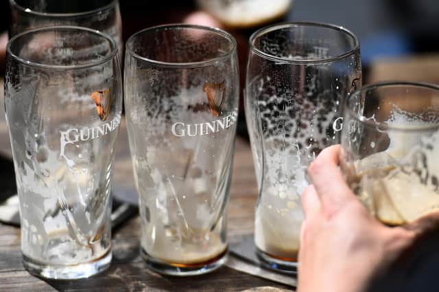 Empty pints of Guinness. (Photo by WILLIAM WEST/AFP via Getty Images)