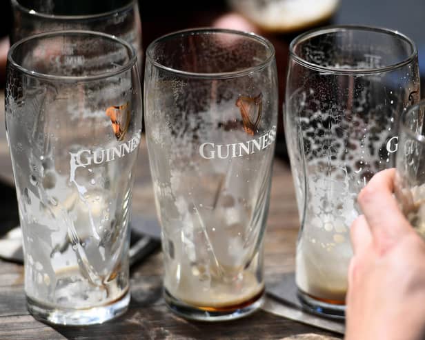 Empty pints of Guinness. (Photo by WILLIAM WEST/AFP via Getty Images)