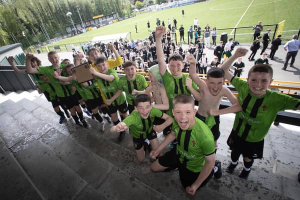 The victorious St. Joseph's Boys celebrate victory on Thursday in Belfast. (Photo: Jim McCafferty)