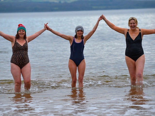 Swimmers who braved the elements to take part in the annual ARC Fitness New Years Day Charity Swim at Lisfannon beach.  Photo: George Sweeney. DER2301GS  09