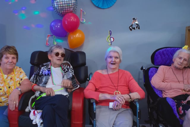 Husband and wife Mary and Michael Harkin, and Adeline McClintock and Flo Murphy at the 1960s and 1970s themed party at the Oakleaves Care Centre.