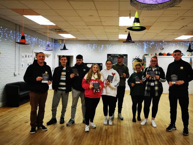 CRJ staff Mickey Anderson(left) and Eamon Mc Ginley (right) pictured with Youth leaders from the Glen and Rosemount at the fireworks safety work
