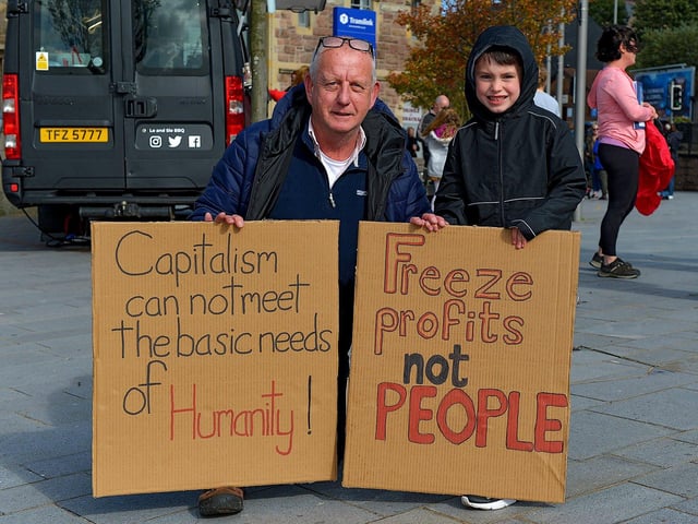 Nigel Cook and his nephew Jonas Fahy pictured at the Derry Against Fuel Poverty march and rally on Saturday afternoon last. Photo: George Sweeney. DER2239GS – 098