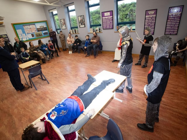 Mr. McQuillan explains the costume drama '1066' taking place in the history department at St. Columb's College on Saturday. : .