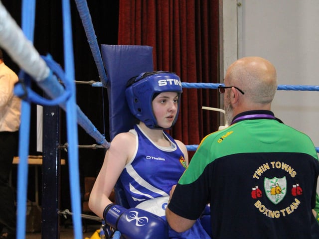 This young boxer from Twin Towns Boxing Club receives instructions from her coach.