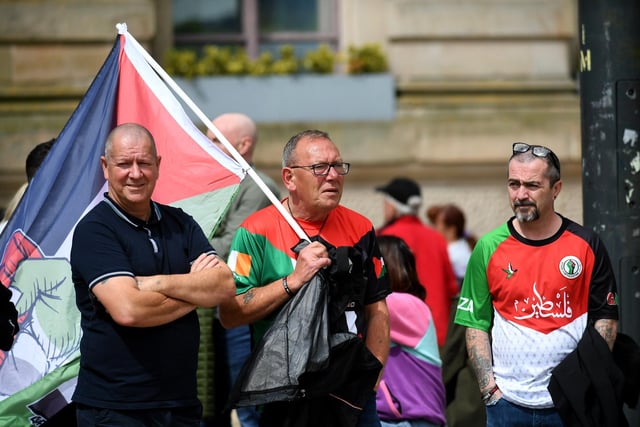 People gather at a rally in Guildhall Square, organised by the Derry Branch of Ireland Palestine Solidarity Campaign to mark 300 days of Genocide in Gaza. Photo: George Sweeney