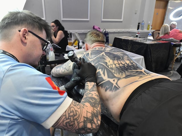 Tattoo artists at the annual Maiden City Ink International Tattoo Convention held in the Everglades Hotel. Photo: George Sweeney