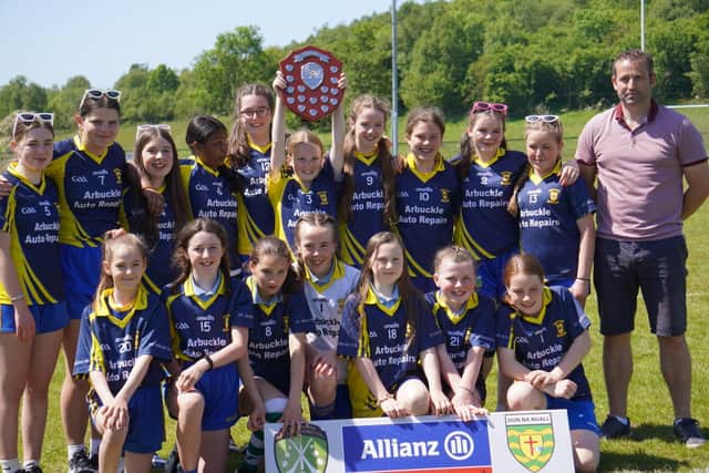 St. Aengus N.S., Bridgend celebrate lifting the Cumann na mBunscoil Girls' Gaelic football county final after a thrilling victory over Creevy N.S in Glenswilly last week.