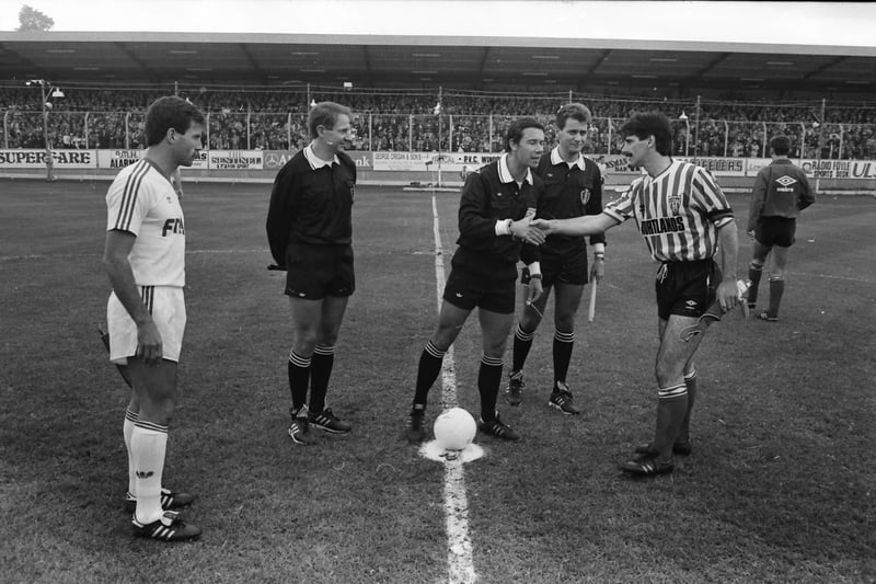 Team captains Felix Healy and António Veloso with the match officials.