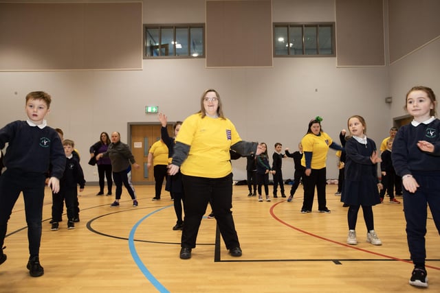 Members of Foyle Down Syndrome Trust having a dance with pupils of Bunscoil Colmcille