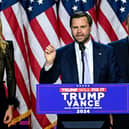 US Senator from Ohio and Republican vice presidential candidate J.D. Vance (C) speaks alongside former US President and Republican presidential candidate Donald Trump during an election night event at the West Palm Beach Convention Centre in West Palm Beach, Florida, on November 6, 2024. Republican former president Donald Trump closed in on a new term in the White House early November 6, 2024. (Photo by Jim WATSON / AFP) (Photo by JIM WATSON/AFP via Getty Images)
