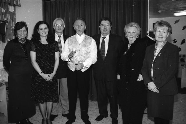 Phil Coulter, pictured with, from left, Teresa McKeever, Mary Crumley, Tony O'Doherty, John Hume, Mrs. Kate Neeson and Mrs. Pat Hume, at St. Mary's Community Centre.