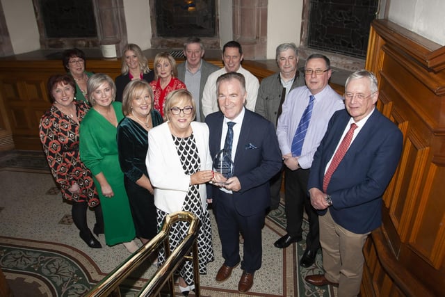 Carmel Dunn, former Principal of Hollybush PS pictured with her husband and family during Wednesday’s Mayoral Reception in the Guildhall.