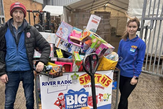 Smyths staff with some of the donated toys.