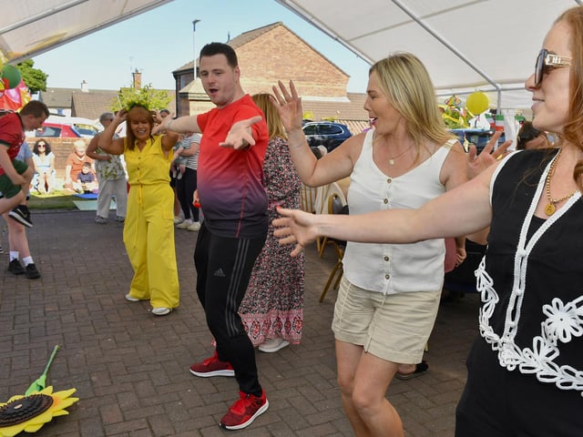 Enjoying the dancing and music at the Annual Farland Way Hazelbank Big Lunch. Photo: George Sweeney