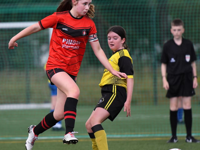 An Irvinestown Wanderers player leaps into action during their girls under-13's match against Dunree FC.