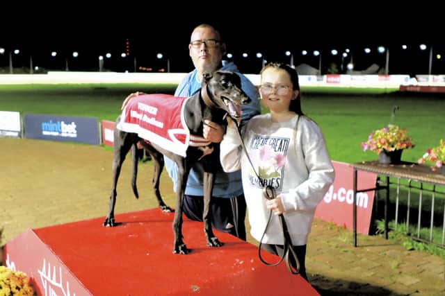 Galliagh Black, winner of Join the North West Greyhound and Breeders Association 550, pictured with Ciaran McLaughlin and his niece Caitlin McLaughlin.