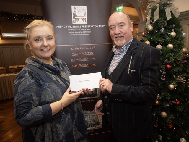 Lisa Bradley, Inner City Trust, pictured handing over a cheque to Raymond Craig, North West Counselling, at the Bishop's Gate Hotel, Derry on Thursday afternoon last. The event was part of the Inner City Trust's Annual Charity Giving. (Photos: Jim McCafferty Photography)