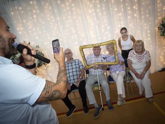 Micky Doherty gets in on the act of taking photos during Tuesday's event. : .