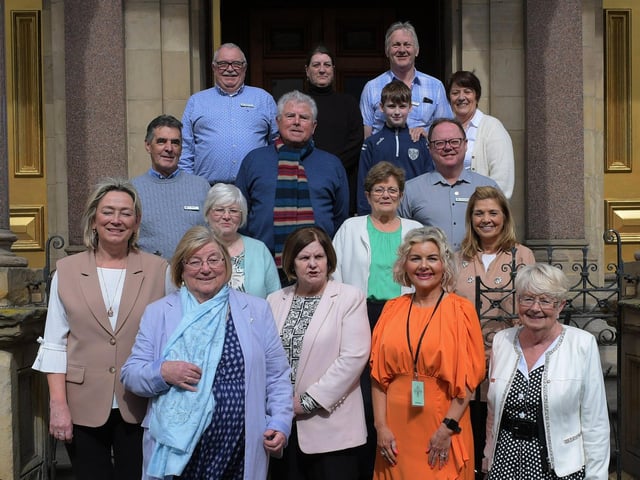Some members of the Feis Dhoire Cholmcille Committee and Feis Volunteers pictured outside St Columb’s Hall on the final day of this year’s feis. Front row, left to right are Aisling Bonner (Secretary), Ursula Clifford (Chair and Registrar), Betty Gallagher (Speech and Drama Secretary), Genevieve Sweeney (Cups and Trophies Co-ordinator), Colette Craig (Hostess Co-ordinator); Second row, left to right are Siobhan Watts (Administrator), Kathleen McGlinchey (Competitions Co-ordinator), Christine McIvor (Treasurer); Third row, left to right are Jimmy McAdams (Volunteer), Pat MacCafferty (Music Secretary), Eamon Sweeney (Press and Communications Officer); Back row, left to right are Brendan Molloy (Traditional Music Co-ordinator), Briedge Curran (Feis Volunteer), Oisin Donnelly (Feis Volunteer), Martin McNamee (Finance Assistant) and Maureen Molloy (Feis Volunteer). Photo: George Sweeney
