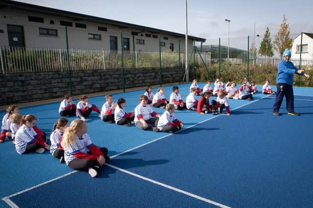Learning to play tennis with coach Ron Smith at the Waterside Shared Village courts on Thursday morning were pupils from Lisnagelvin Primary School. The event was part of DCSDC's 'Game of Three Halves - Small Ball' event. 
