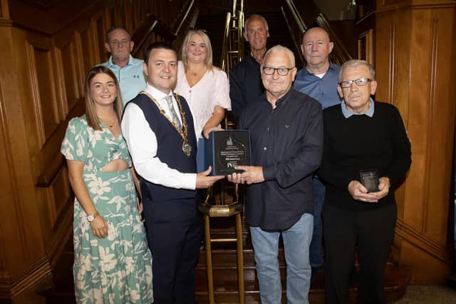 The Mayor of Derry City and Strabane District Council, Ruairí McHugh making a presentation to Martin 'Gills' McGilloway, chair of the Eamonn 'Bronco' Bradley Football Tournament Committee in recognition of their 40th anniversary on Friday evening at the Guildhall. (Photos: Jim McCafferty Photography)