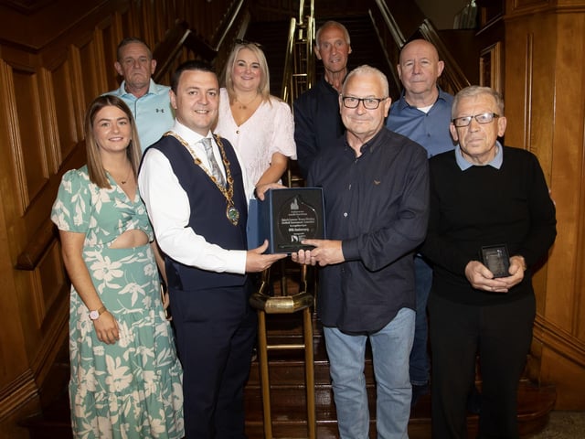 The Mayor of Derry City and Strabane District Council, Ruairí McHugh making a presentation to Martin 'Gills' McGilloway, chair of the Eamonn 'Bronco' Bradley Football Tournament Committee in recognition of their 40th anniversary on Friday evening at the Guildhall. (Photos: Jim McCafferty Photography)