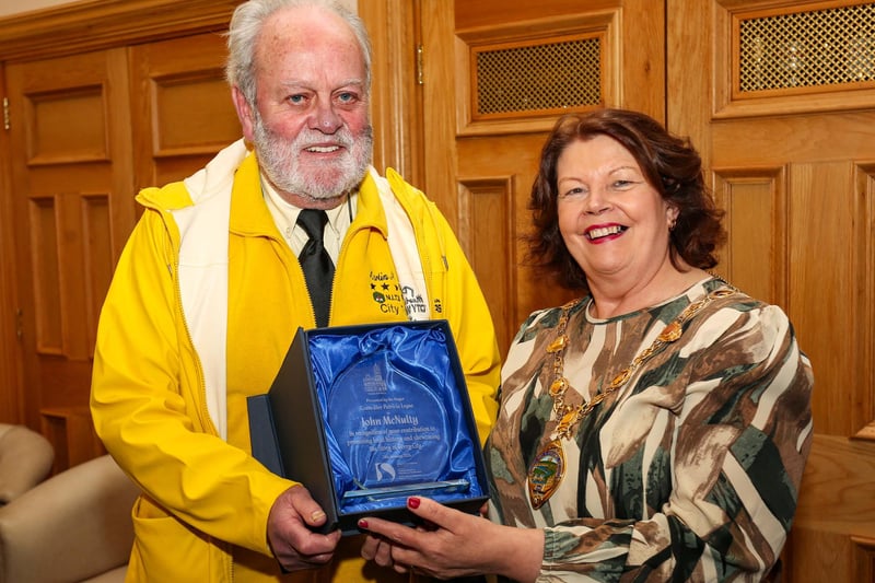The Mayor of Derry and Strabane, Councillor Patricia Logue, presenting a civic gift to tour guide John McNulty at a reception in the Guildhall to mark his 20 years as a local tour guide with Martin McCrossan City Tours. Credit ©Lorcan Doherty