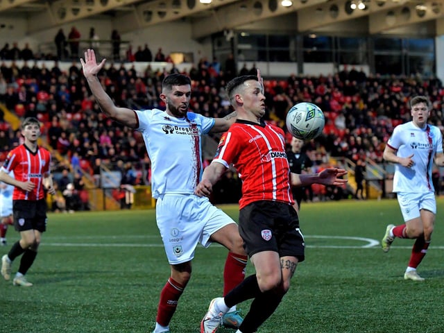 Derry City’s Ben Doherty shields the ball from Luke Heeney of Drogheda United. Photo: George Sweeney. DER2314GS – 15