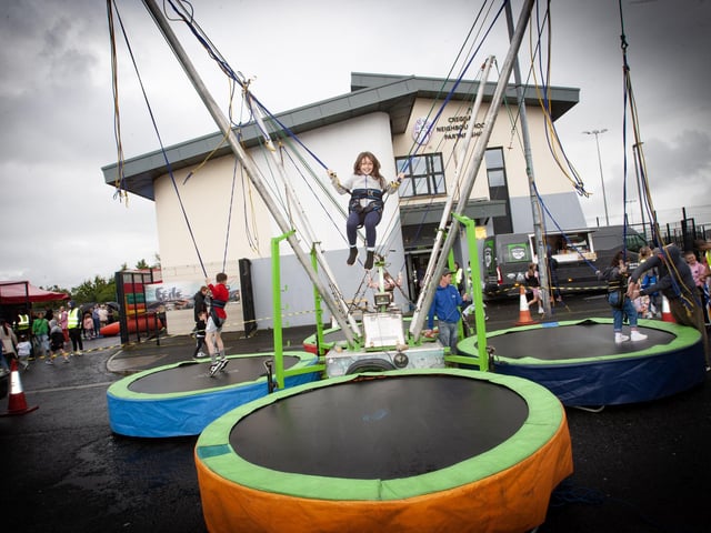 Seven years old Olivia Mattreus doesn't let the darkening skies bother her as she bounces for job at the Féile 23s Wan Big Party in Creggan on Tuesday. (Photos: Jim McCafferty Photography)