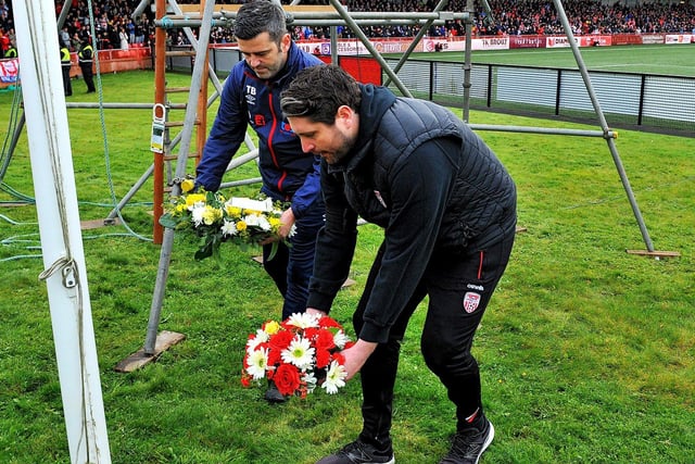 Derry City manager Ruairi Higgins and Treaty United manager Tommy Barrett place floral tributes at Brandywell Stadium, in memory of the recent Cresslough tragedy.  Photo: George Sweeney.  DER2242GS – 019