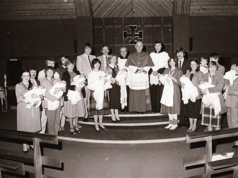 Bishop Daly with newly baptised infants at Holy Family Church during pastoral visitation to Ballymagroarty.