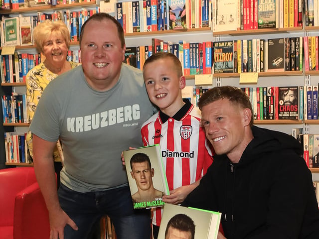 Professional footballer James McClean signing his autobiography, “The Walls” in Waterstones, Foyleside, for Kevin and James McBride. (Photo - Tom Heaney, nwpresspics)