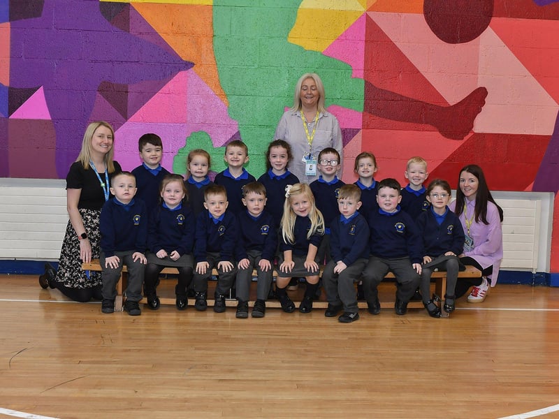 Teacher Miss Lynch (left) with P1 pupils and classroom assistants at St Therese Primary School.