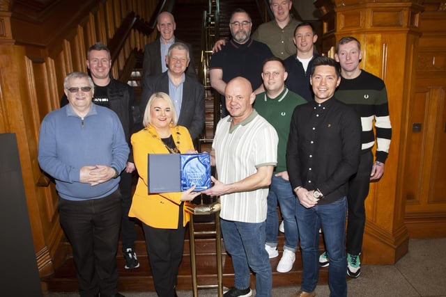 The Mayor of Derry City and Strabane District Council, Sandra Duffy makes a special presentation to Liam McLaughlin, St. Joseph’s Boxing Club to mark the club’s celebration of 30 years in existence, during a reception in the Guildhall on Thursday night last. Included are senior club members.