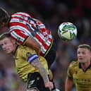 Wrexham skipper James McClean  tussles with Sydie Peck of Sheffield United.