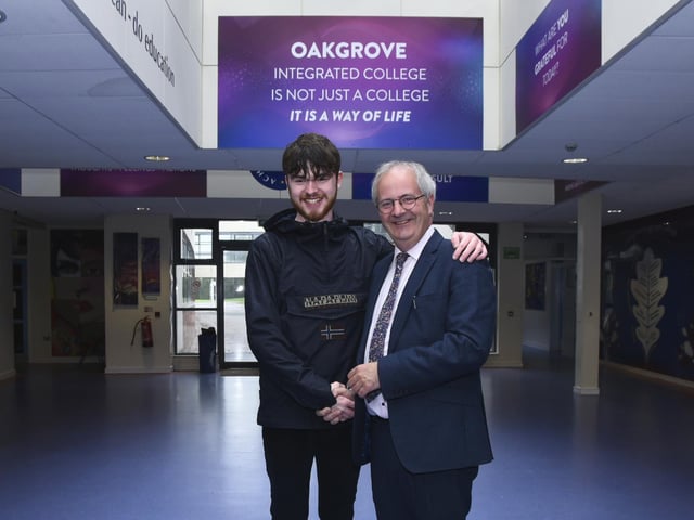 Oakgrove College A Level student Jack Quinn is congratulated by Principal John Harkin