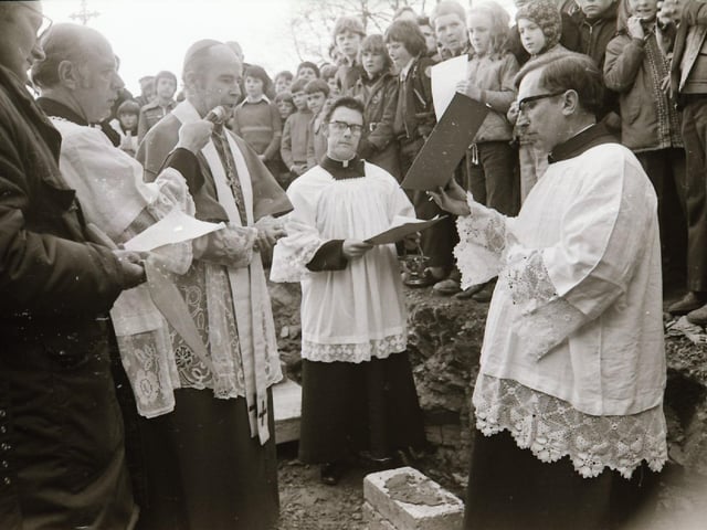 Laying the foundation stone at the new Our lady of Lourdes church.