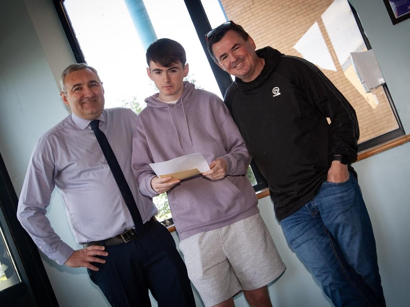 Mr. Gerry Beattie, St. Joseph's Boys School pictured with A Level student Pearse MacCafferty and his dad Peter.